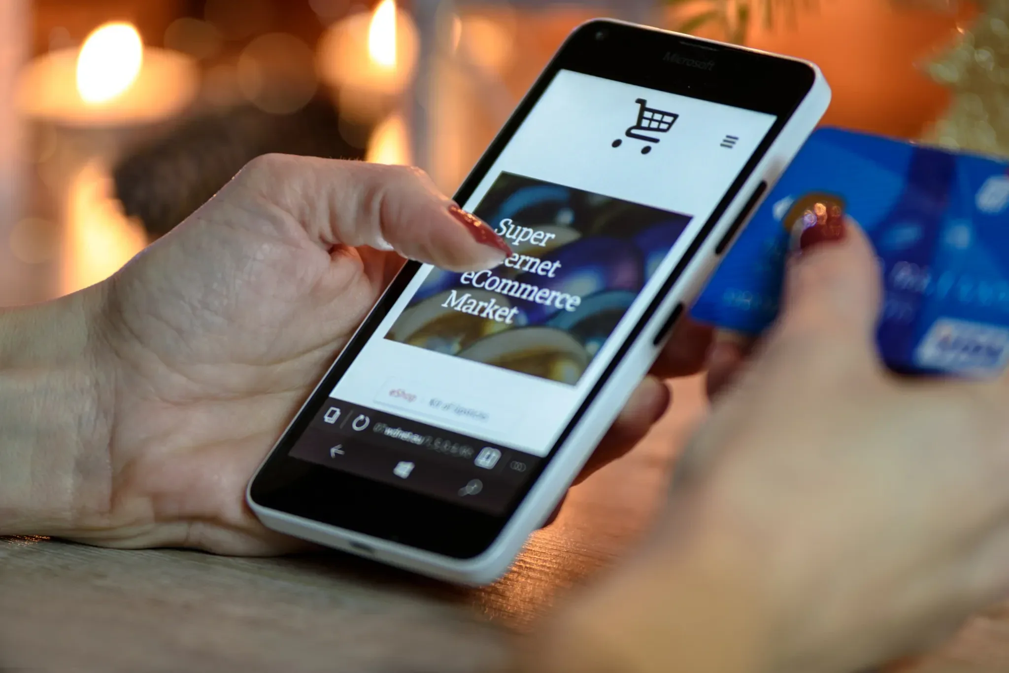 E-commerce accounting Thailand: online shopper using a phone and card to buy from a marketplace