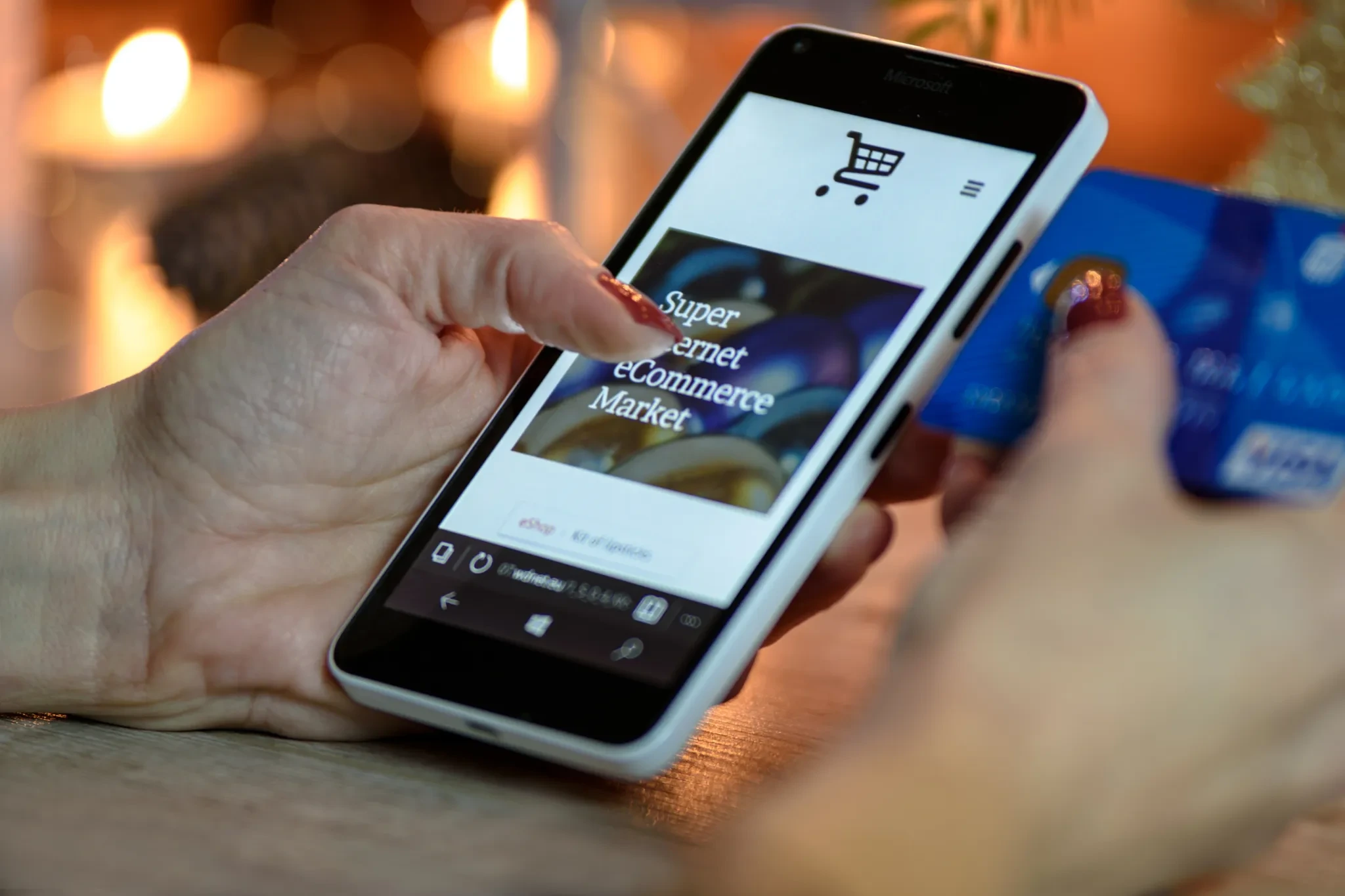 E-commerce accounting Thailand: online shopper using a phone and card to buy from a marketplace