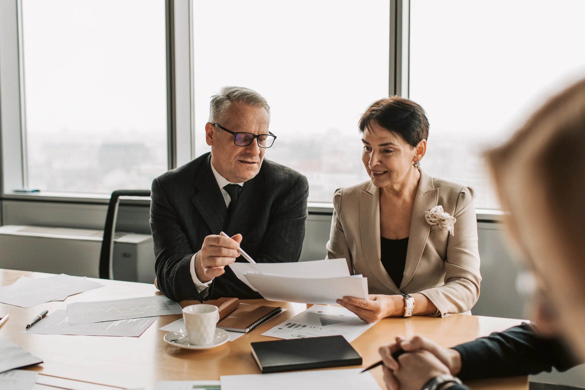 Consulting firm professionals reviewing financial documents for accounting and tax compliance in Thailand.